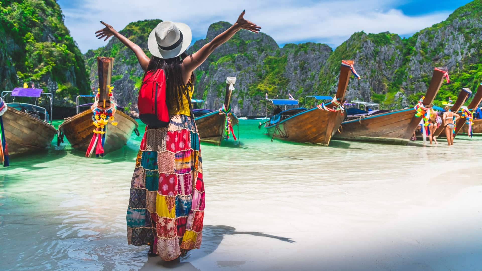Tourist exploring Thailand island beach & boats